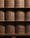 A distinctive perspective of stacked wood, prepared for the subsequent steps in the handcrafting process of Sonus faber speakers.