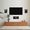 A living room wall equipped with in-wall Sonus faber Palladio speakers and a TV.